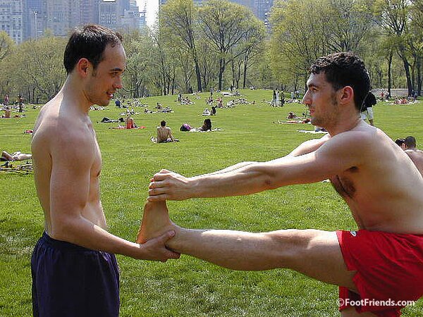 Cute guys Jimmy and Boris play barefoot in the park and show off their sexy feet
