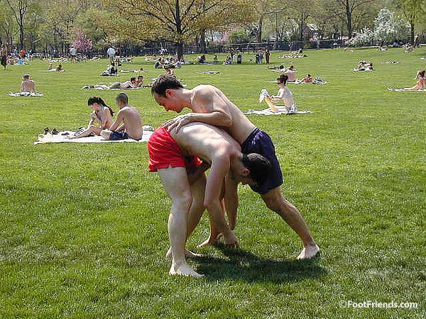 Cute guys Jimmy and Boris play barefoot in the park and show off their sexy feet