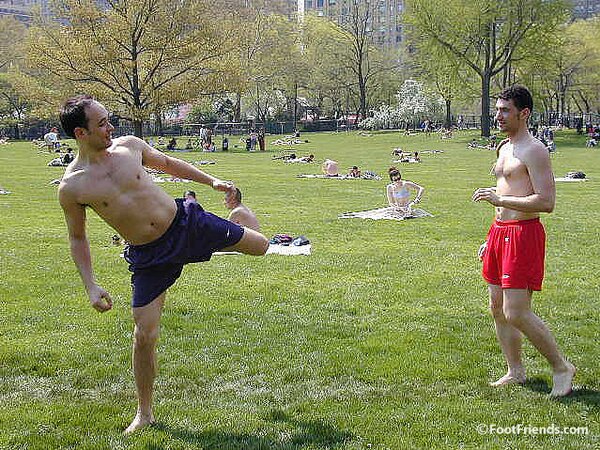 Cute guys Jimmy and Boris play barefoot in the park and show off their sexy feet