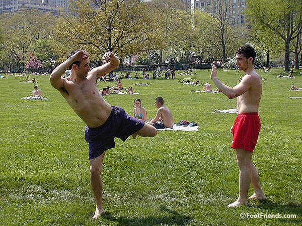 Cute guys Jimmy and Boris play barefoot in the park and show off their sexy feet