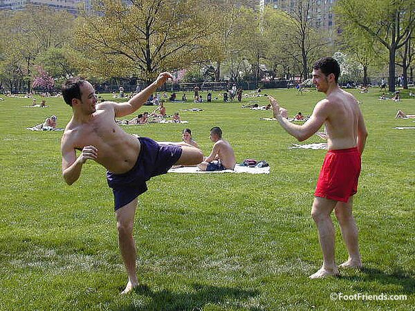 Cute guys Jimmy and Boris play barefoot in the park and show off their sexy feet