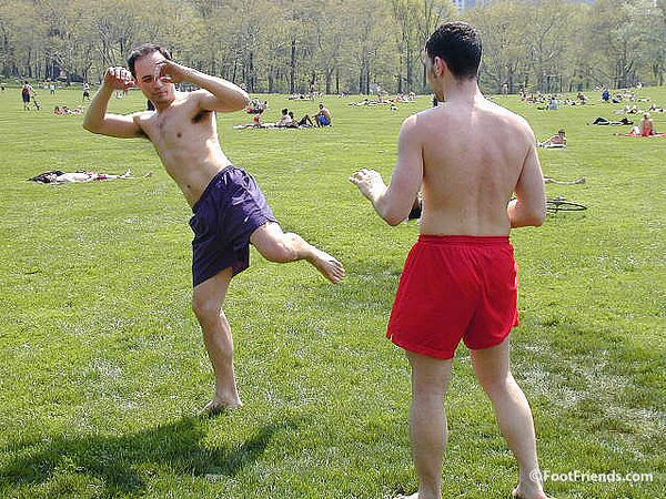 Cute guys Jimmy and Boris play barefoot in the park and show off their sexy feet