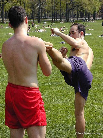Cute guys Jimmy and Boris play barefoot in the park and show off their sexy feet
