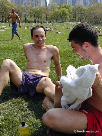 Cute guys Jimmy and Boris play barefoot in the park and show off their sexy feet