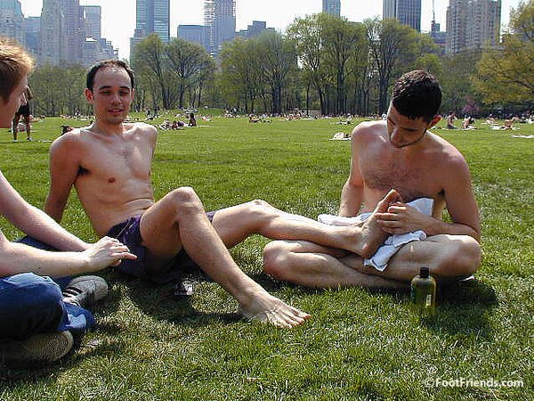 Cute guys Jimmy and Boris play barefoot in the park and show off their sexy feet