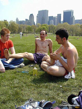 Cute guys Jimmy and Boris play barefoot in the park and show off their sexy feet