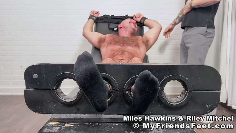 Riley Mitchel tickles athletic Miles Hawkins until he’s screaming with laughter