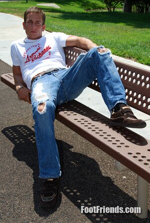 Muscular Jakub stretches outside and shows off his favorite shoes and black socks