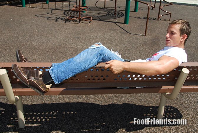 Muscular Jakub stretches outside and shows off his favorite shoes and black socks