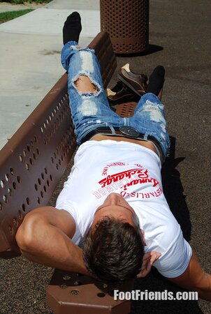 Muscular Jakub stretches outside and shows off his favorite shoes and black socks