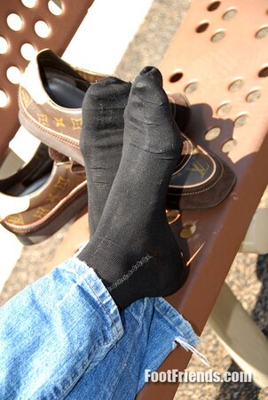 Muscular Jakub stretches outside and shows off his favorite shoes and black socks