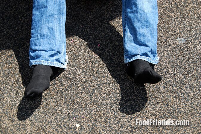 Muscular Jakub stretches outside and shows off his favorite shoes and black socks