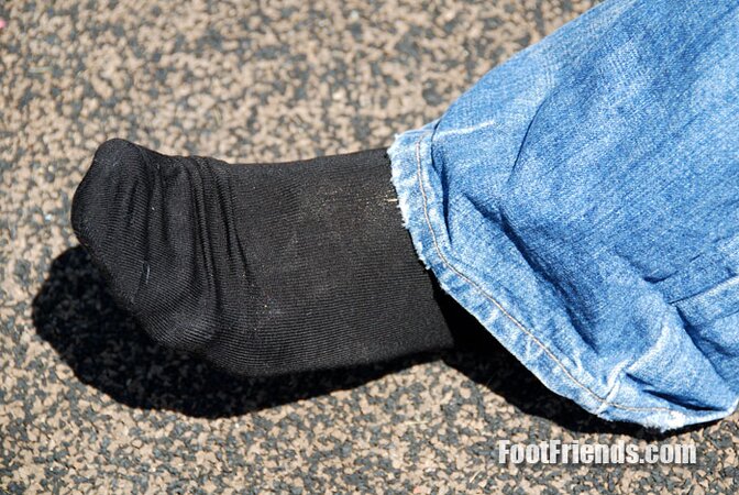 Muscular Jakub stretches outside and shows off his favorite shoes and black socks