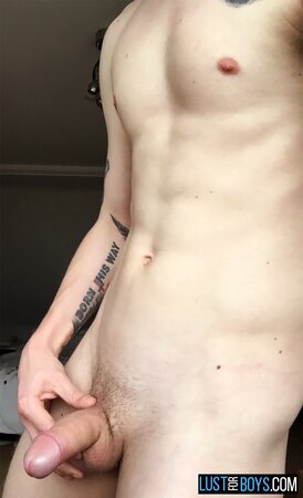 Arron Myers kicks back in his socks and strokes his big uncut cock