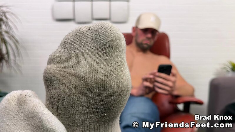 Cowboy Brad Knox slowly peels off his boots and shows off his sexy socked feet