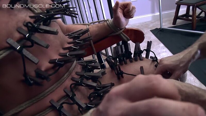 Master Derek Da Silva rips clothespins from pup Cullen Cable’s sensitive skin