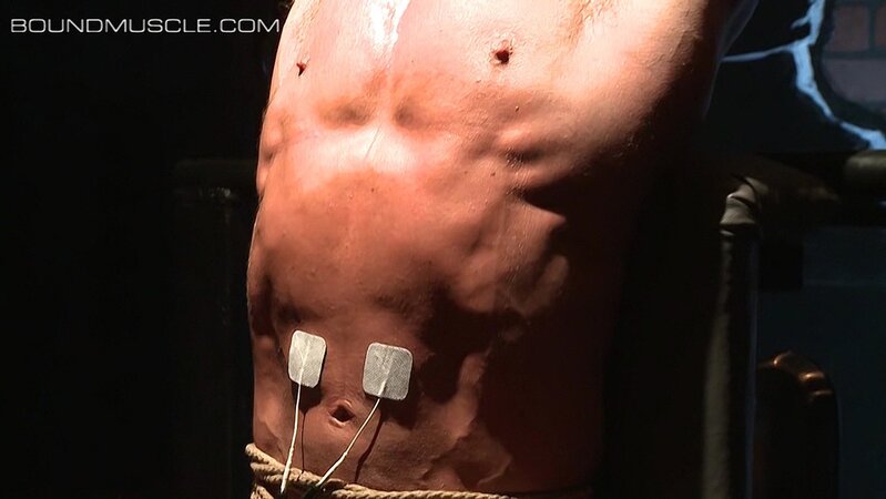 Derek Pain sweats and writhes as Master Mulengro zaps him with intense electrodes
