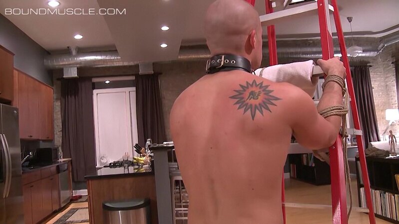 Pup Cullen Cable stands bound against the ladder as Master Derek Da Silva flogs him hard