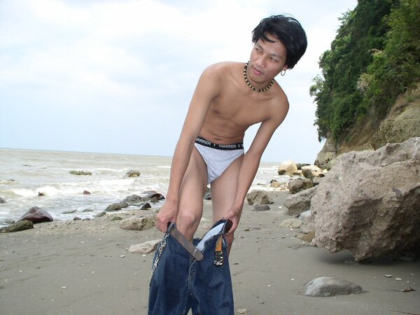 Asian twink Jason strips naked at the rocky beach and jerks off