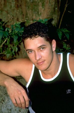 Young Brazilian stud with euro looks and a huge cock strokes by the water
