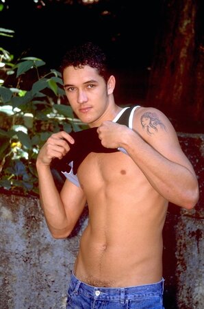 Young Brazilian stud with euro looks and a huge cock strokes by the water