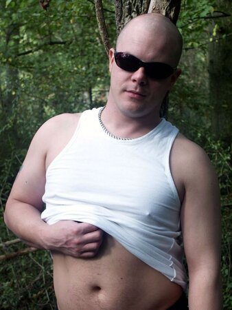 Young cub strips naked in the forest and pumps his fat cock dry