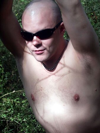 Young cub strips naked in the forest and pumps his fat cock dry