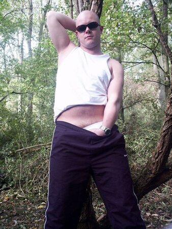 Young cub strips naked in the forest and pumps his fat cock dry