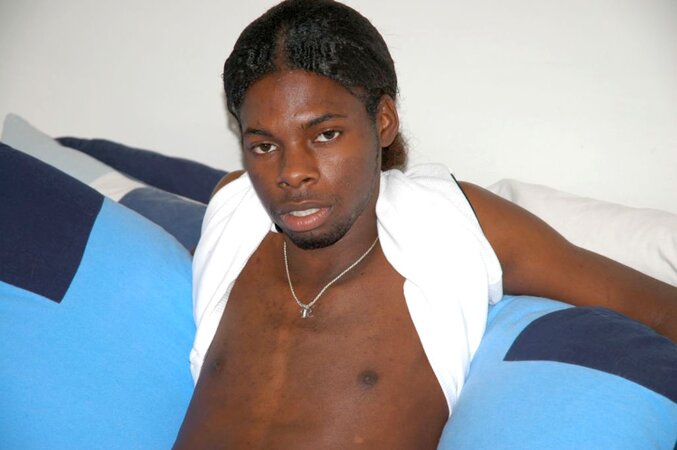 Black stud with a long uncut cock shows off his hot body