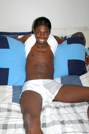 Black stud with a long uncut cock shows off his hot body