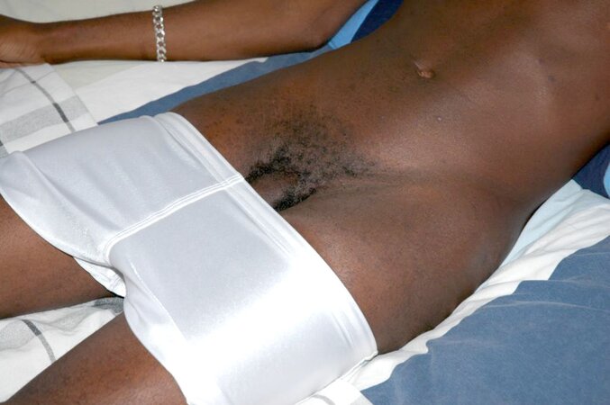 Black stud with a long uncut cock shows off his hot body