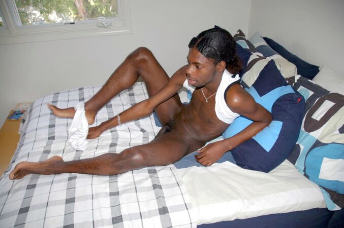 Black stud with a long uncut cock shows off his hot body