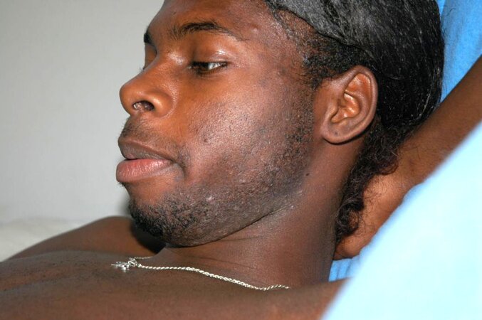 Black stud with a long uncut cock shows off his hot body
