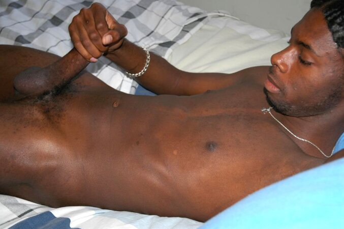 Black stud with a long uncut cock shows off his hot body