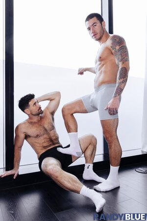 Daniel Justice dominates hairy hunk Beau Butler with deep foot worship and hard fucking
