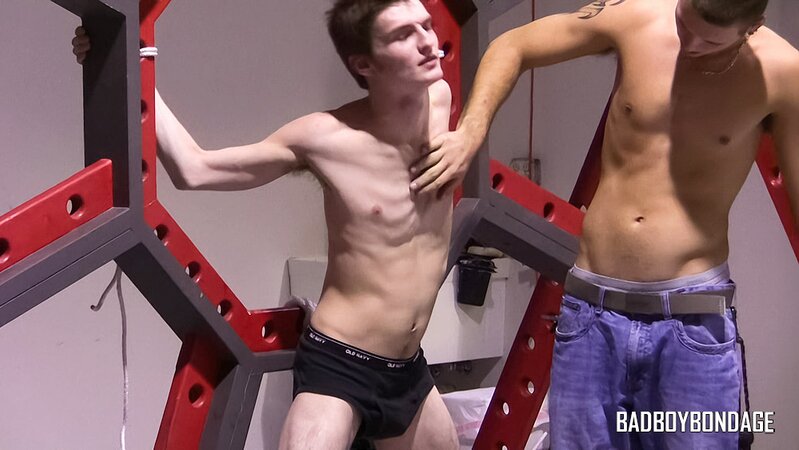 Clint ropes up and flogs his new young prisoner Lester