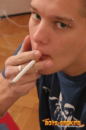 Blonde euro twink Michael smokes hard and sprays the table with cum