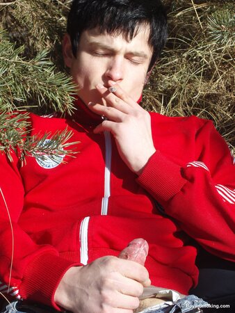 Buff stud Gus smokes and strokes his cock in the snow