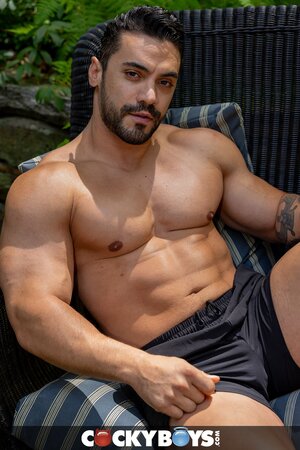 Muscular hunks pound each other deep in a sweaty bareback fuck session