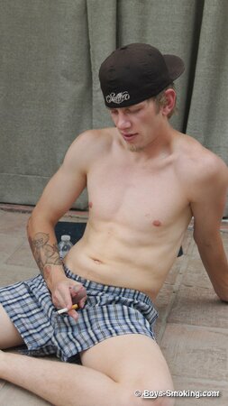 Ian Madrox chainsmokes menthols while stroking his massive cock