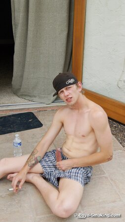 Ian Madrox chainsmokes menthols while stroking his massive cock