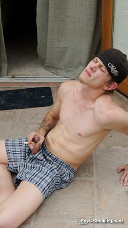 Ian Madrox chainsmokes menthols while stroking his massive cock