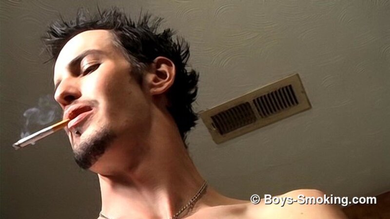 Rocker Axel smokes two cigarettes at once while playing guitar and jerking off
