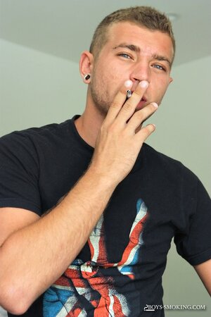 Horse hung Alexander Greene uses both hands while chainsmoking in bed