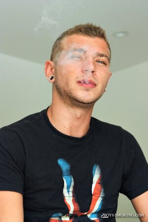 Horse hung Alexander Greene uses both hands while chainsmoking in bed