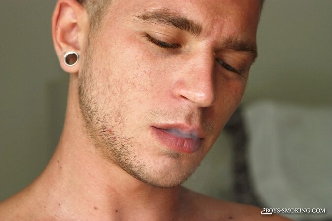Horse hung Alexander Greene uses both hands while chainsmoking in bed