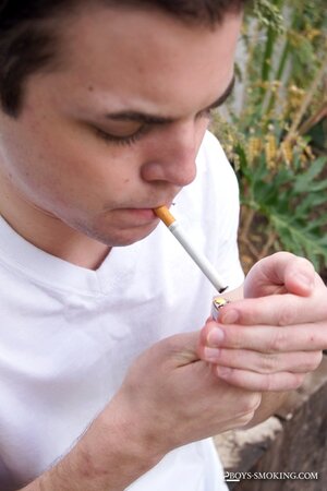 Dustin Fitch chainsmokes outdoors while stroking his big twink dick