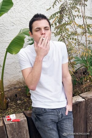 Dustin Fitch chainsmokes outdoors while stroking his big twink dick