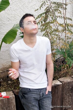 Dustin Fitch chainsmokes outdoors while stroking his big twink dick