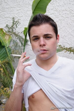 Dustin Fitch chainsmokes outdoors while stroking his big twink dick